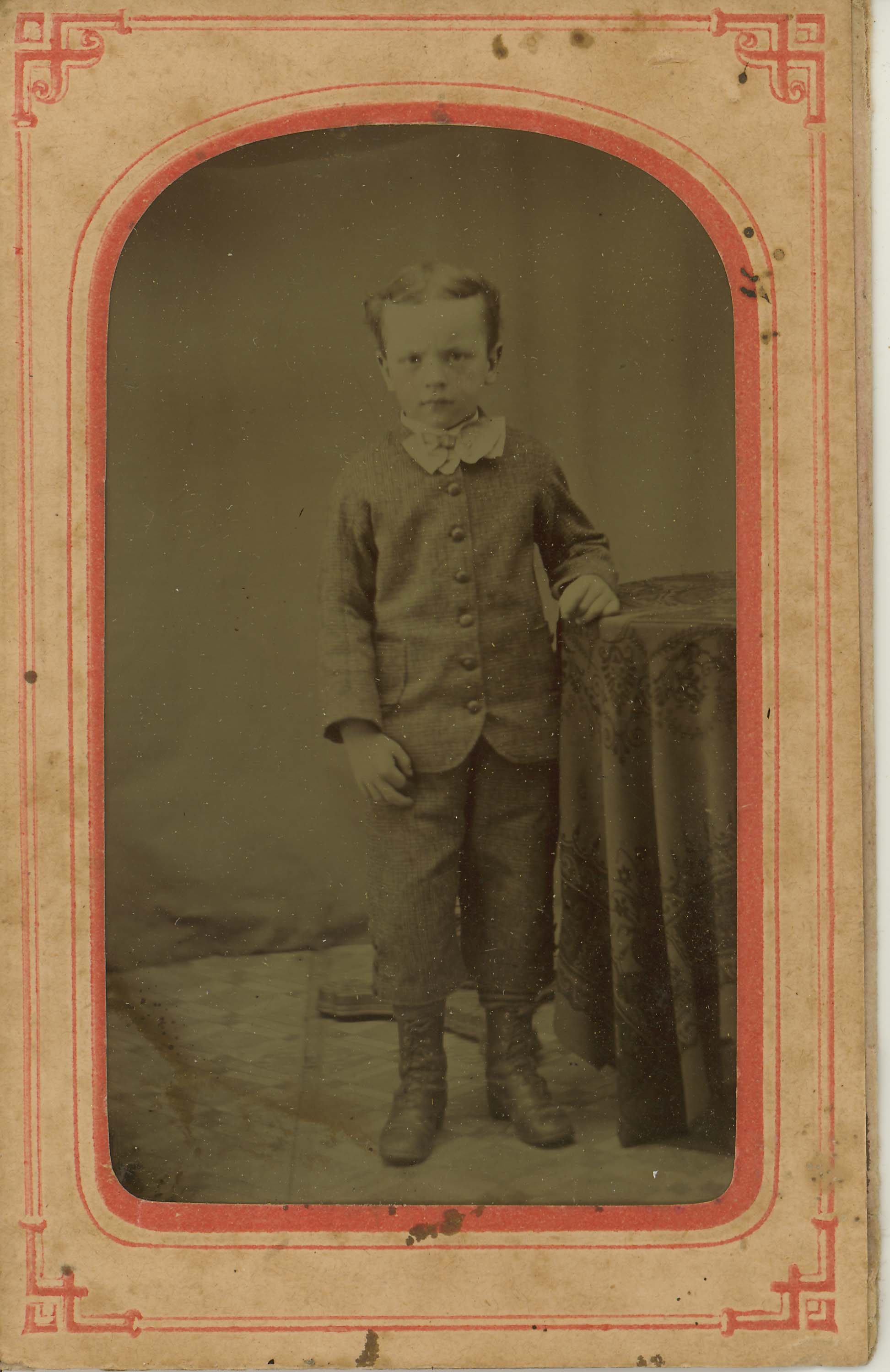 Tin-type-13-Small-boy-mounted-in-arched-pink-and-red-matt