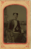Tin-type-15-Portrait-of-seated-woman-mounted-in-arched-pink-and-red-matt