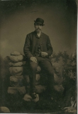 Tin-type-4-Man-seated-on-rock-Wall